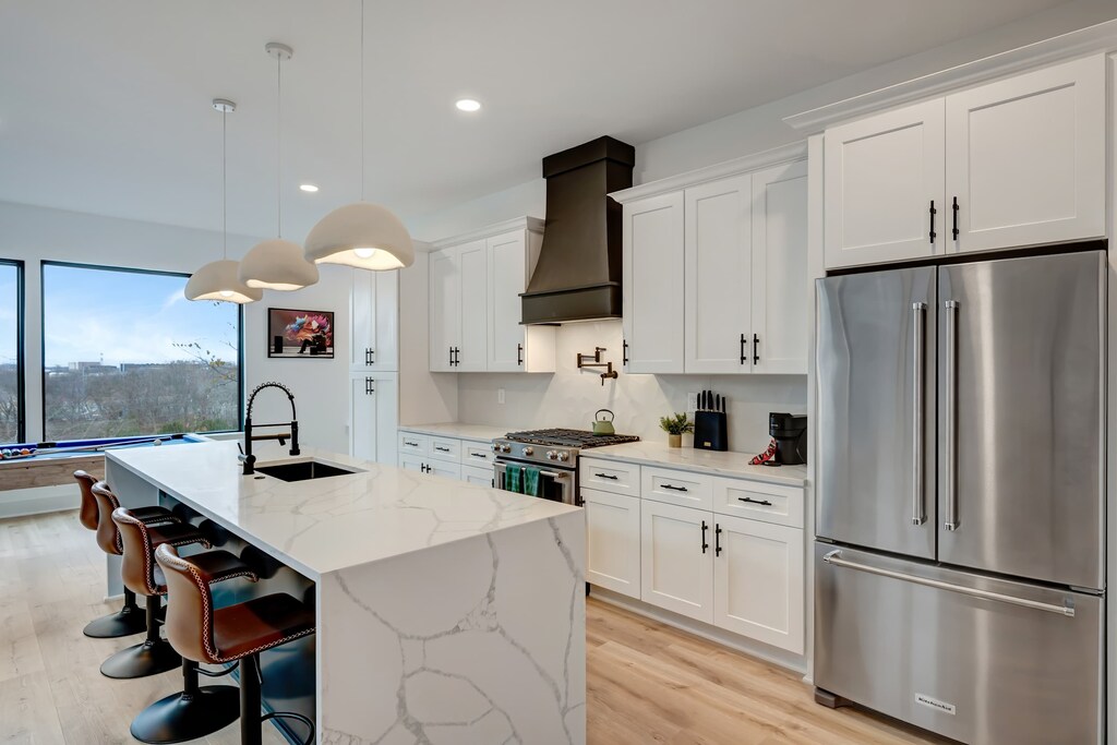 Experience the heart of Music City in this stunning new build! With chic decor and a spacious layout, your group can gather in style. Perfect for Nashville group vacations, reserve your stay today with Misfit Homes!