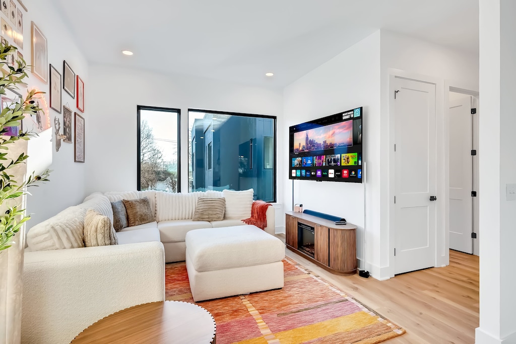 Discover your stylish oasis in Downtown Nashville! Ideal for large groups, this bright living space features a plush sectional, a smart TV for movie nights, and modern decor—perfect for a memorable getaway after a night on Broadway.