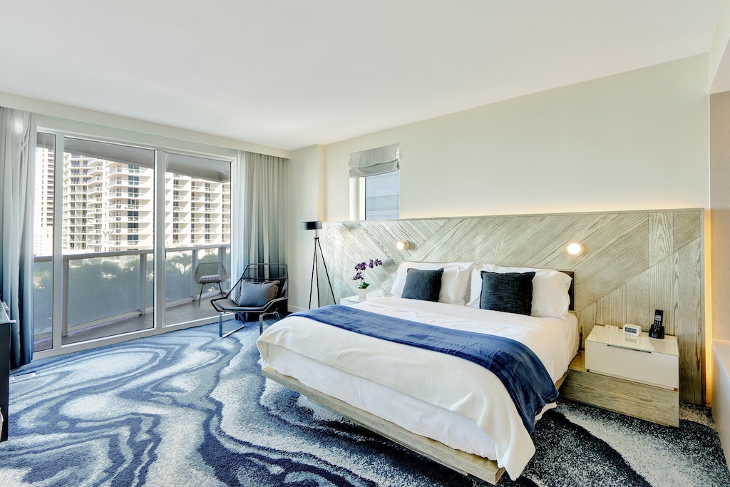 Primary Bedroom | Provides access to your private balcony, king sized bed, and ensuite bathroom.