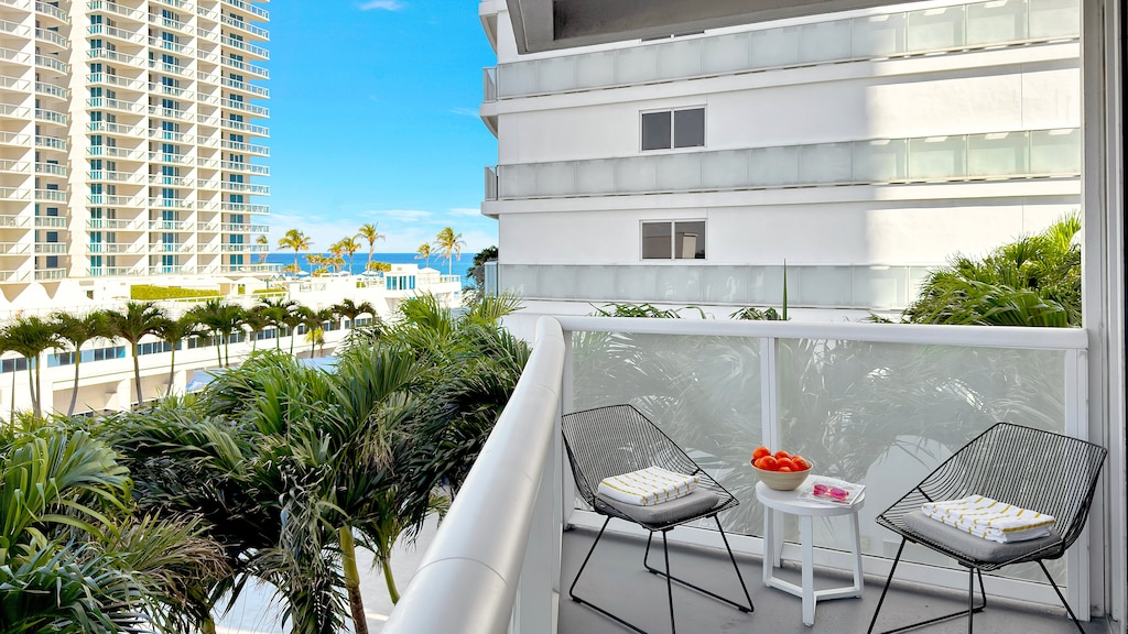 Private Corner Unit Balcony | Ocean view with a conversation seating area.