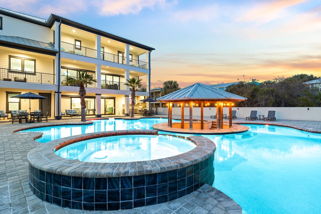 A stunning spa view with a string-lit pavilion and swim-up bar!