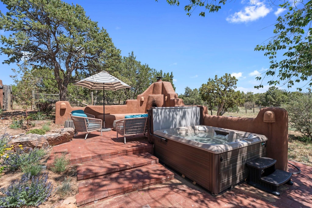 Soak under the stars in your private hot tub with stunning desert views.

