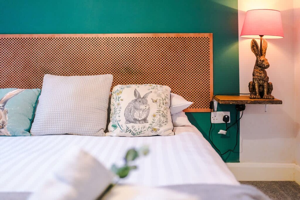 The master bedroom benefits from a comfortable king-size bed, TV and Coffee Machine.