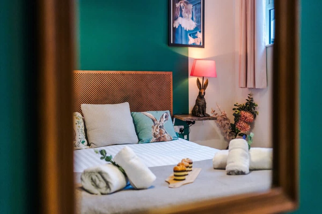 The master bedroom benefits from a comfortable king-size bed, TV and Coffee Machine.