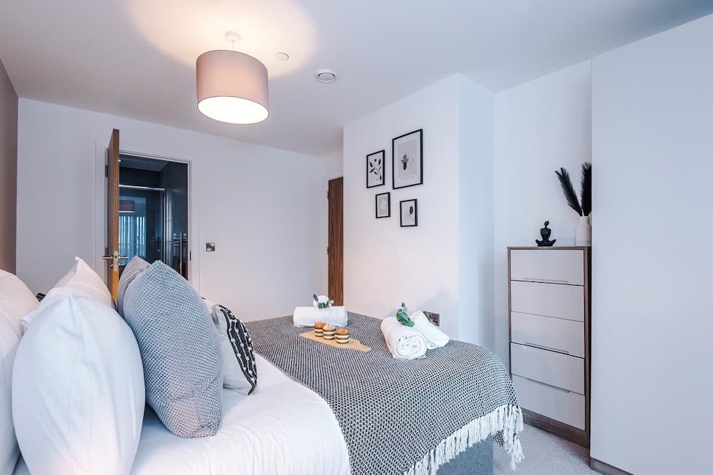 Bedroom 1 benefits from a comfortable double bed, plenty of storage and an en-suite bathroom with a toilet, sink and shower cubicle.