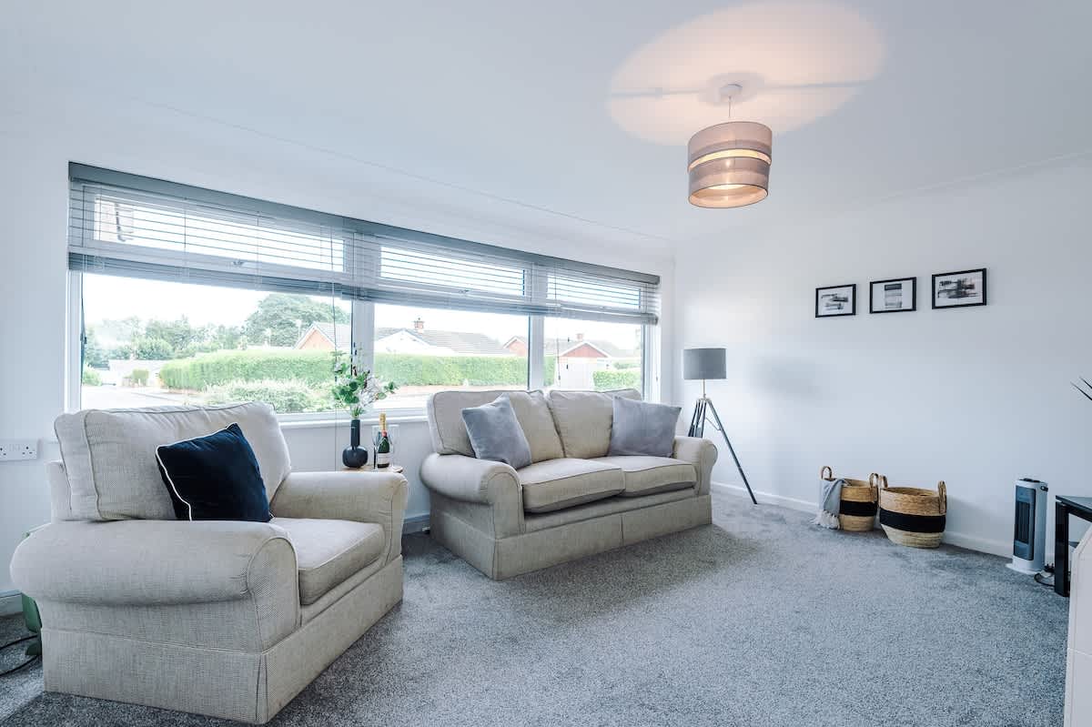 The spacious living space benefits from a 40-inch smart TV and plenty of space to sit down and relax.