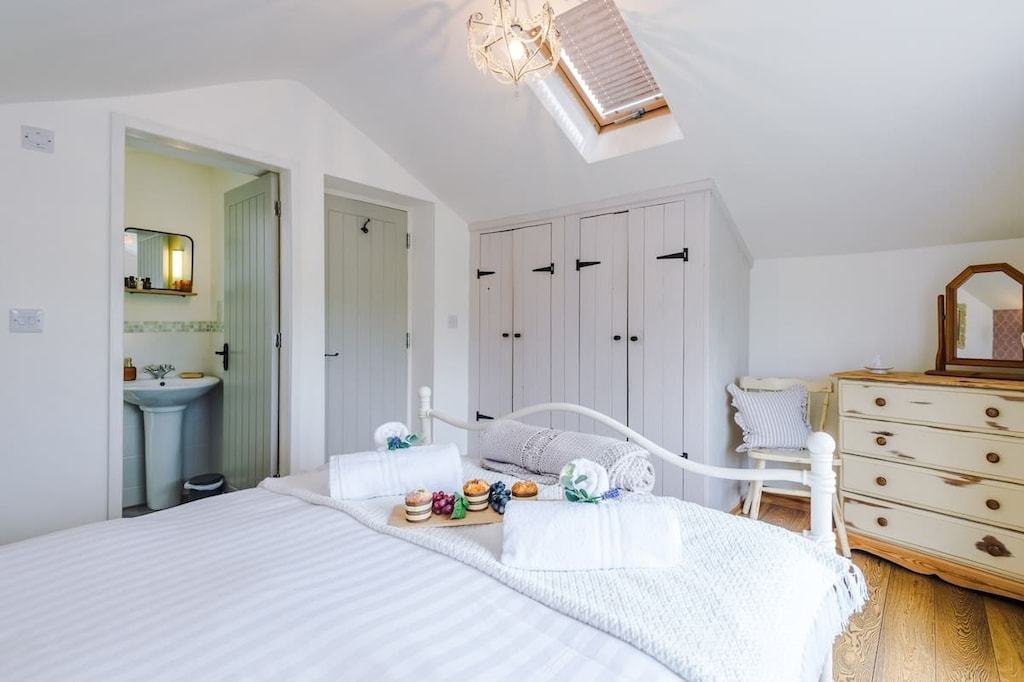 The master bedroom is located upstairs and is equipped with a comfortable king-size bed. 