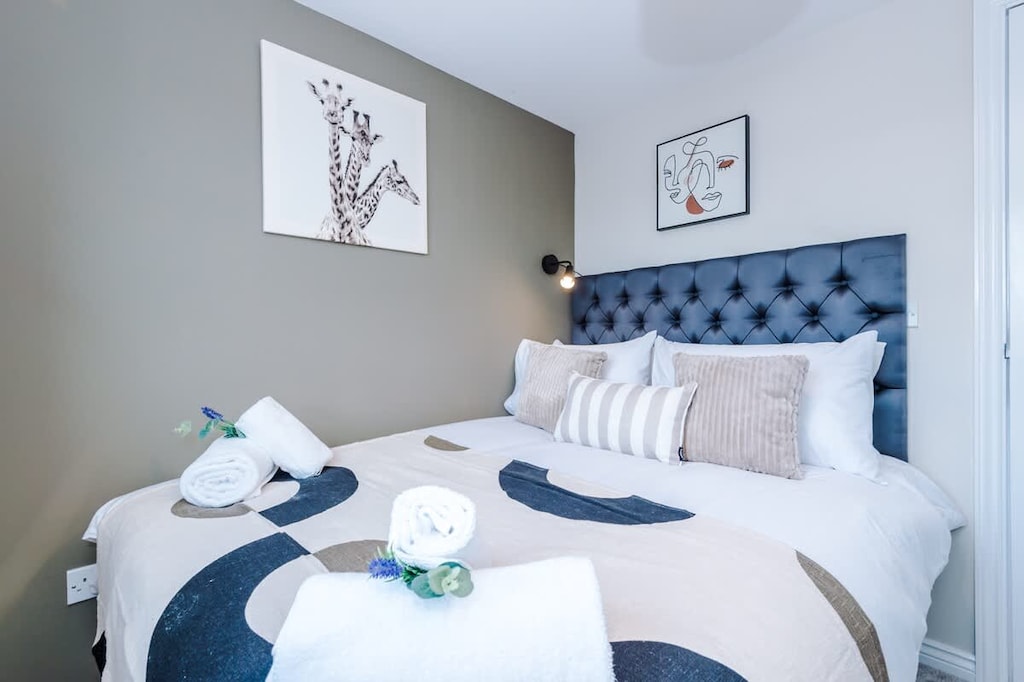 Bedroom 2 benefits from a comfortable double bed and plenty of storage.