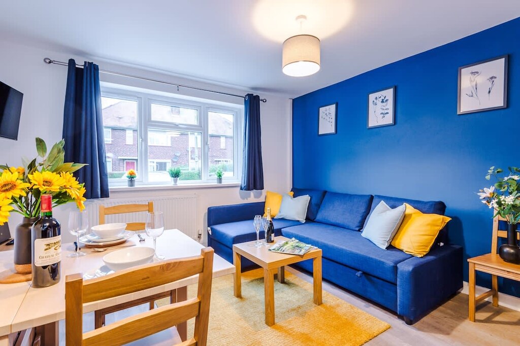 The open plan living room benefits from a double sofa bed, 4 seater dining table and fully equipped kitchen.