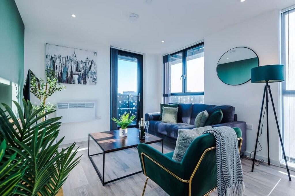 The open-plan living room, dining area and kitchen benefit from a 50-inch Smart TV, a 4-seater dining table, plenty of space to sit down in the evenings and a sizable wrap-around balcony.