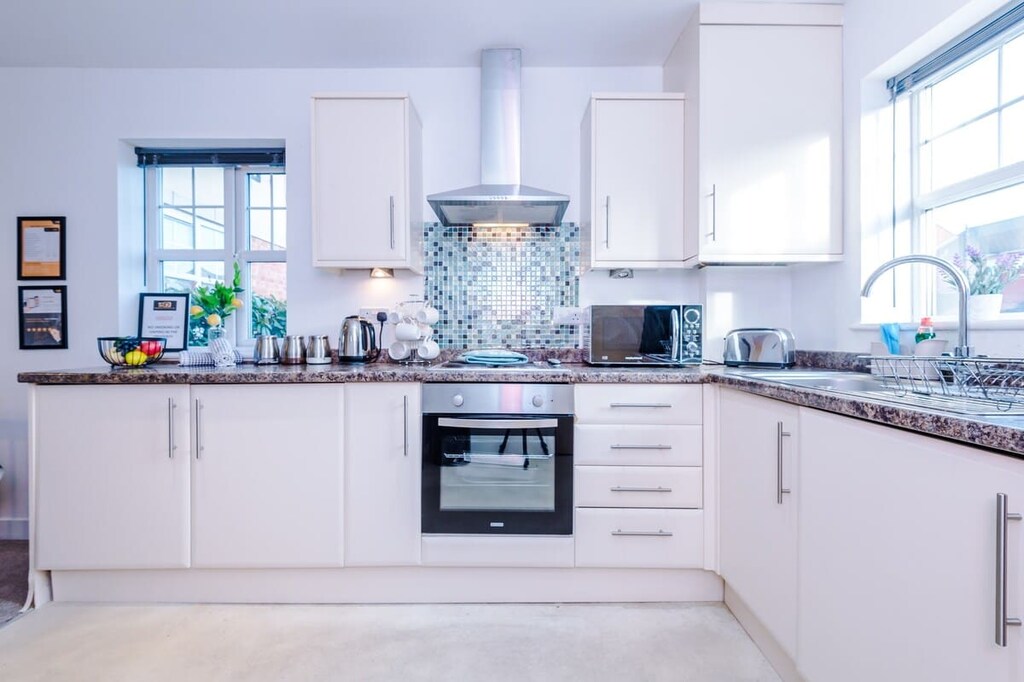 Open plan kitchen benefitting from a microwave, hob, oven, washer/dryer & all your kitchen necessities.