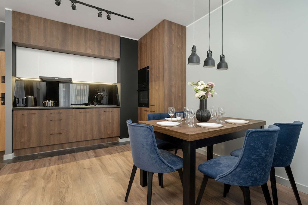 The modern kitchen with a large workspace invites you to cook together and explore new flavors.