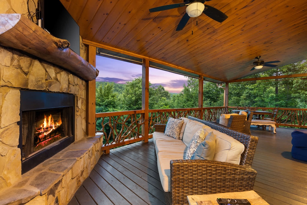 Unwind in style — outdoors! With a comfy plush sofa, Smart TV, and fireplace, this deck lounge brings the comfort of the indoors out into the fresh mountain air.