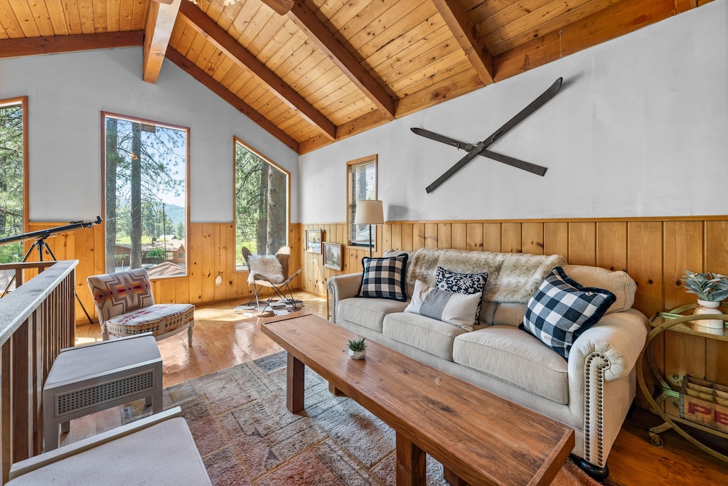 Upstairs Living Room with beautiful windows looking out on peekaboo lake views