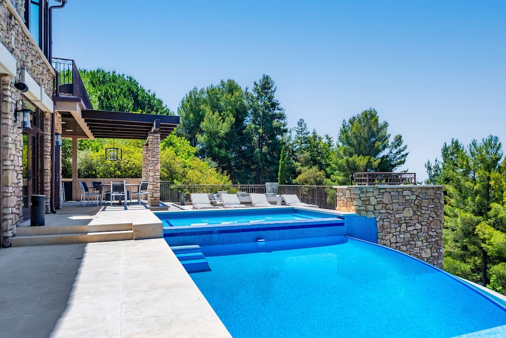 Lounge by the pool and take in stunning mountain views for a truly serene escape.