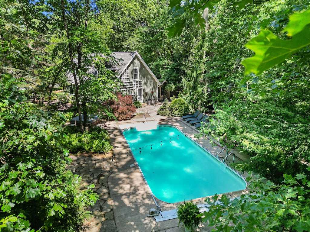 Welcome to Oasis in the Woods—your secluded spa + pool escape.