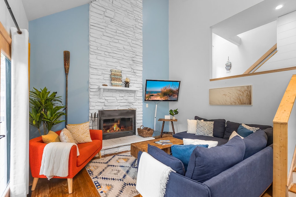 Bold colors, soft cushions, and fireside charm await at La Maison du Lac.