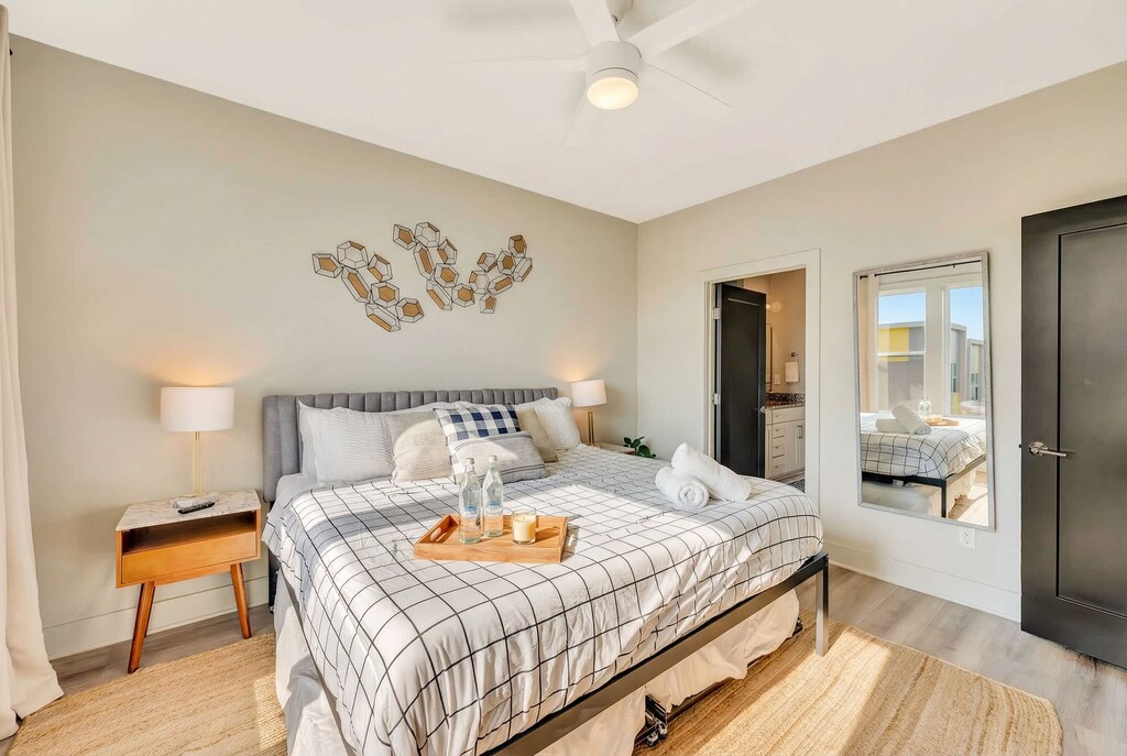 Welcome to your stylish Nashville retreat! This elegant bedroom features plush comforts and an en-suite bath, perfect for relaxing after city adventures. Ideal for bachelorette parties or family reunions, enjoy Music City luxury in your upscale oasis!