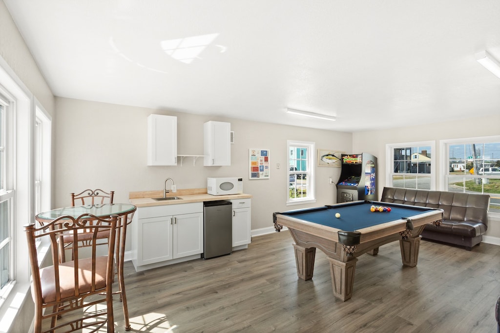 Enjoy a game of Pool in the Pool House with a Wet Bar and extra refrigerator!