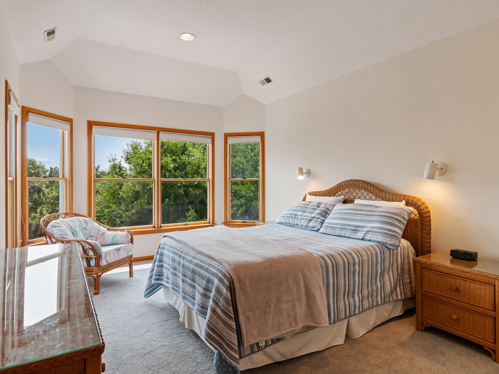 Retreat to the Top Level Queen Master Bedroom with sunset views over the sound and a Master Bathroom with a Whirlpool Tub and Shower.