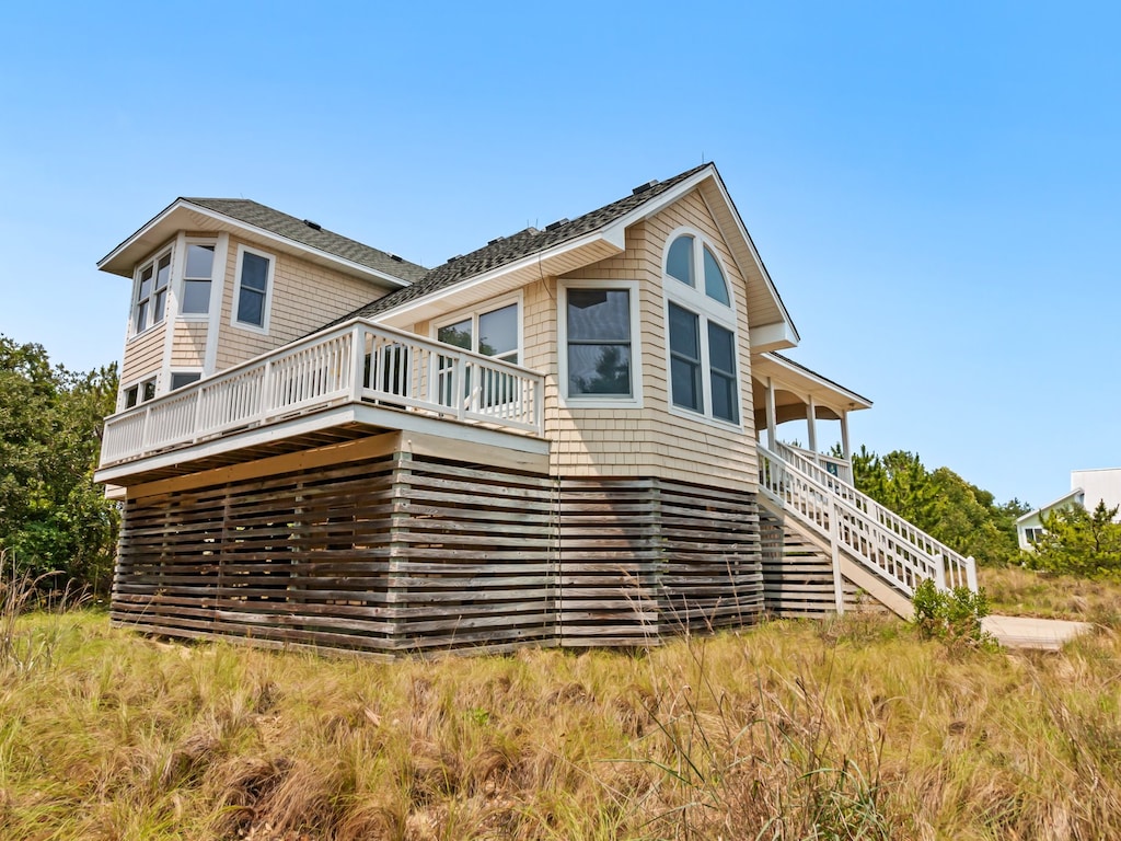 Enjoy decadently coastal relaxation at this lovely sound-side home on a large lot in a peaceful setting.