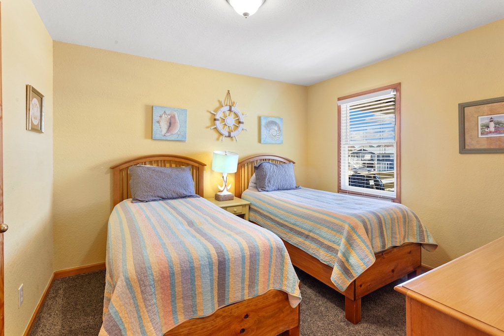 Mid-level bedroom with two twin beds.