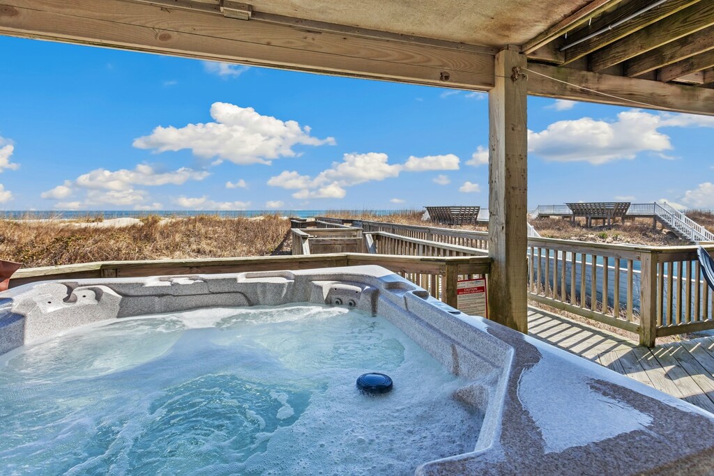 Unwind in the bubbly hot tub on the deck.