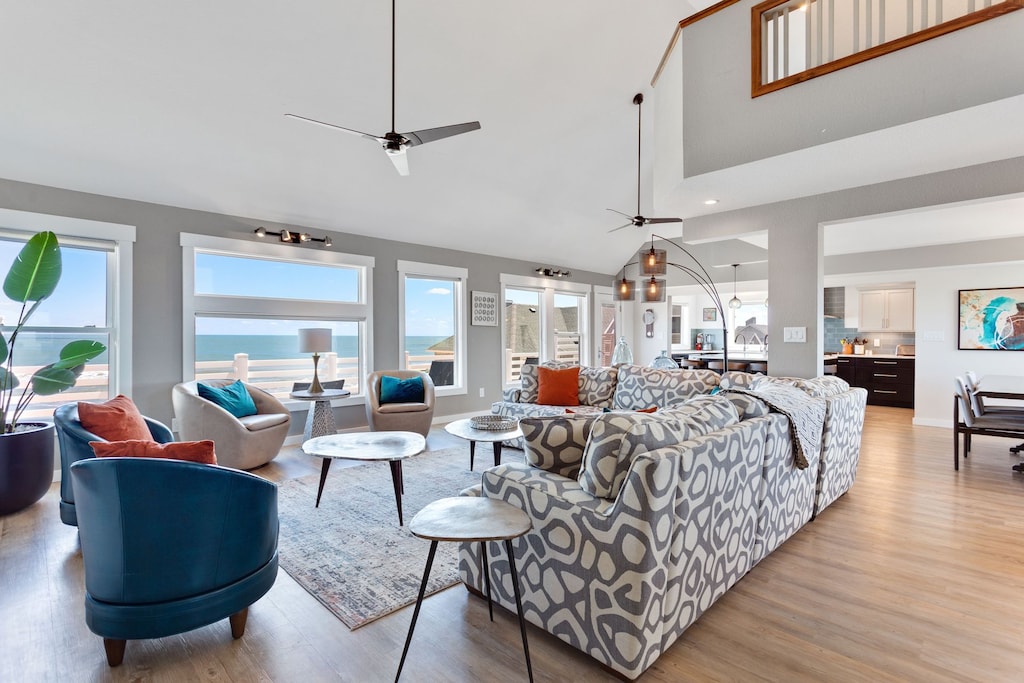 Relax in the Main Living Area in one of the cozy couches or modern chairs with ocean views and plenty of unique, minimalist light fixtures curated for a calm, relaxing environment.