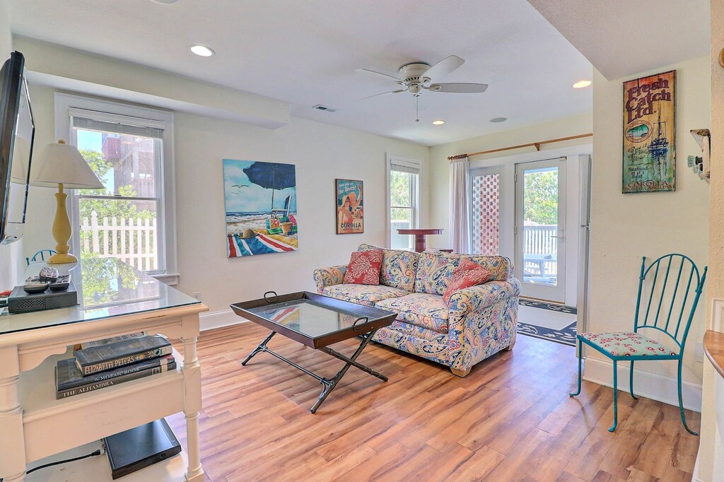 The Ground-Level Living Area boasts an additional TV and plenty of space to relax.