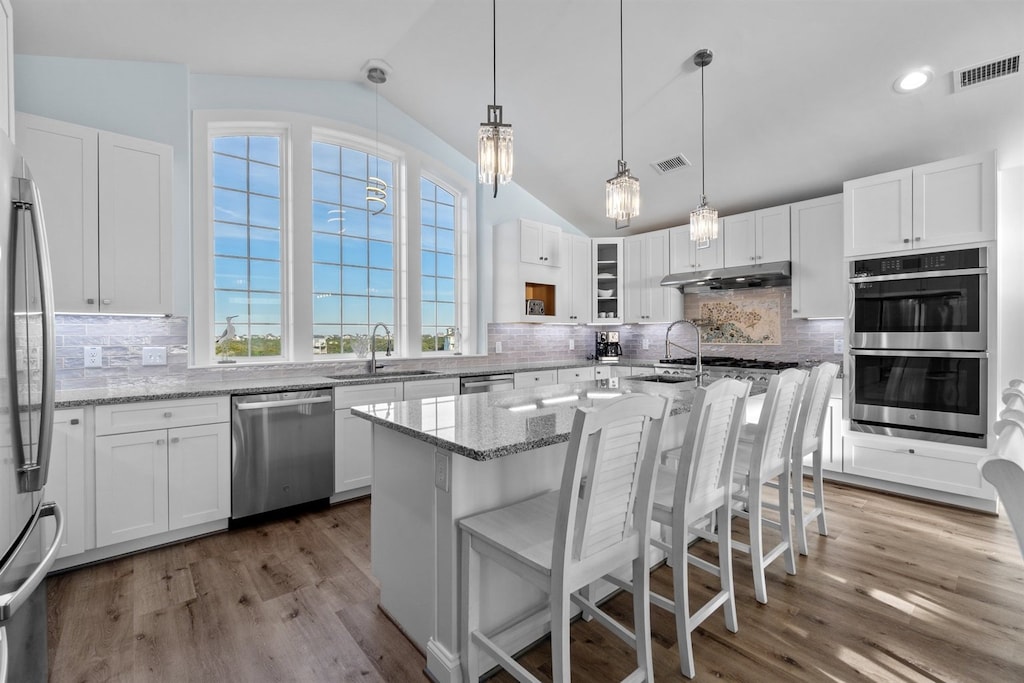 The chef's Kitchen boasts stainless steel appliances and two refrigerators to keep everyone well-fed and refreshed.