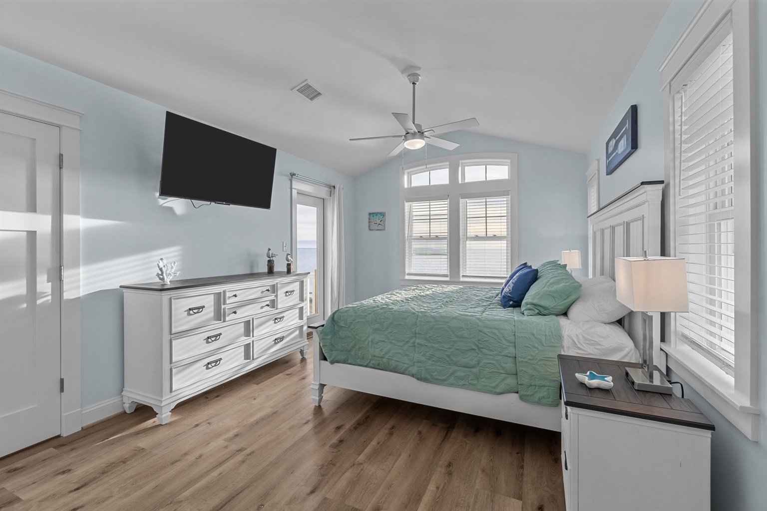 Two luxurious King Master Bedrooms with private bathrooms and deck access round out the top level, offering peaceful retreats with stunning views.