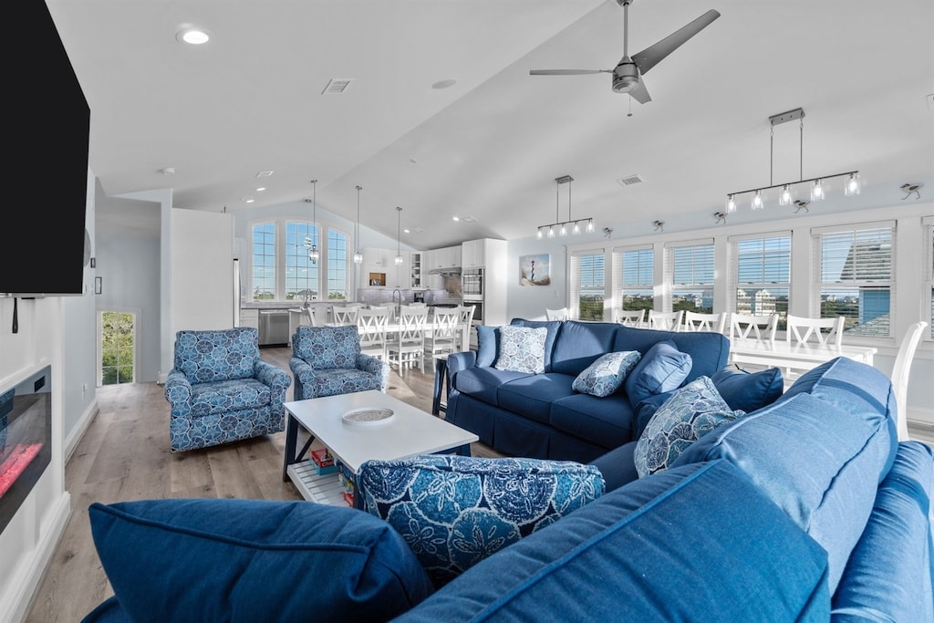The Top Level is the perfect place to relax after a day exploring the Outer Banks, featuring an open-concept Living Area with an LED fireplace.