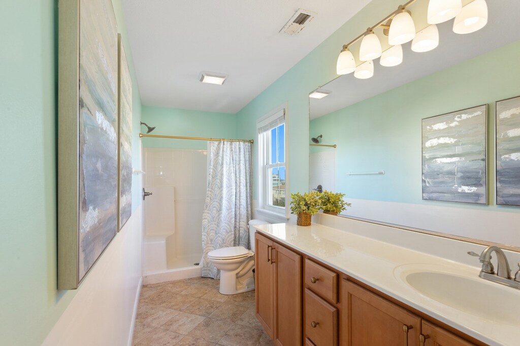 Retreat to the Top-Level King Master Bedroom with its private bathroom for a peaceful night's rest.