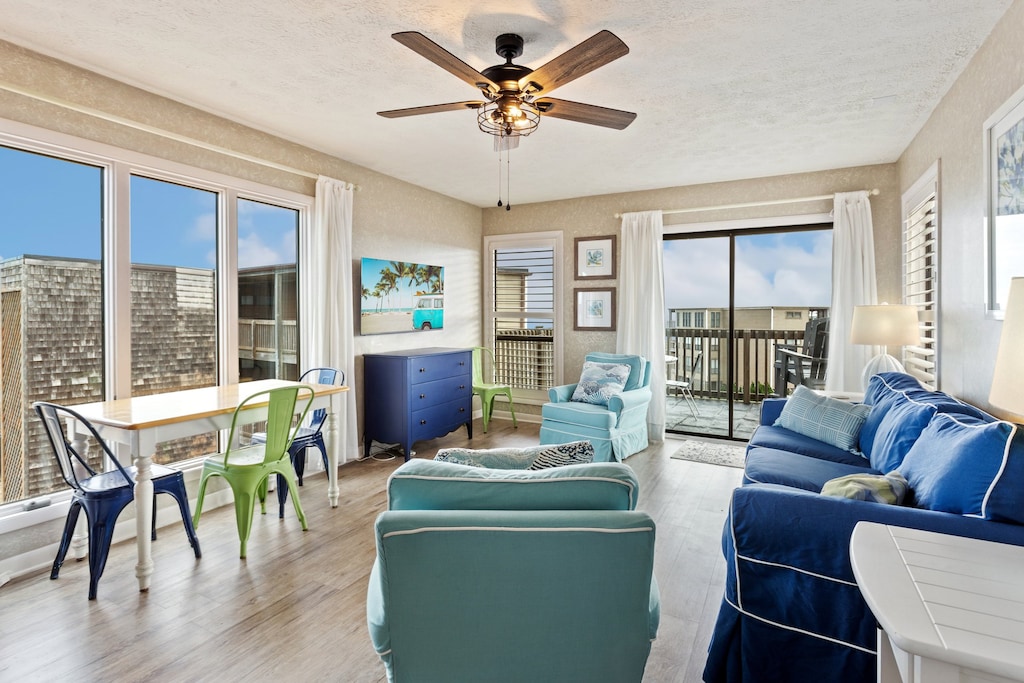 Unwind in the spacious Living Area with plenty of windows and bright natural light.