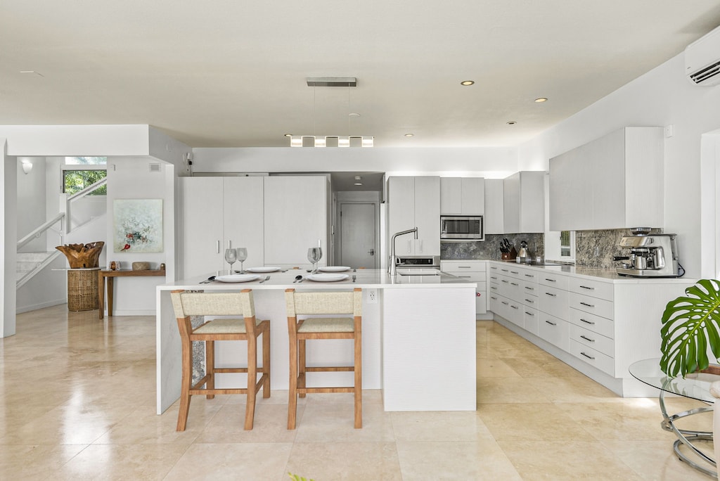 Prep, serve, and socialize with ease at this oversized kitchen island featuring seating and views into the bright great room.