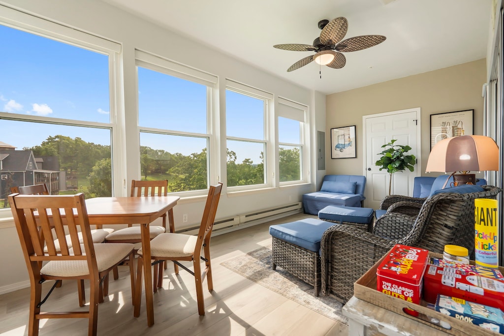 The sunroom includes a fantastic golf course view, various games and two fold-out twin sleeper ottomans