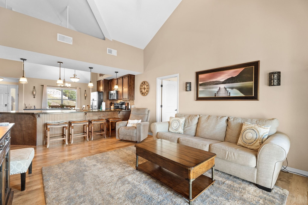 Living Room with Sleeper Sofa, Recliner - Sunroom & Balcony Access