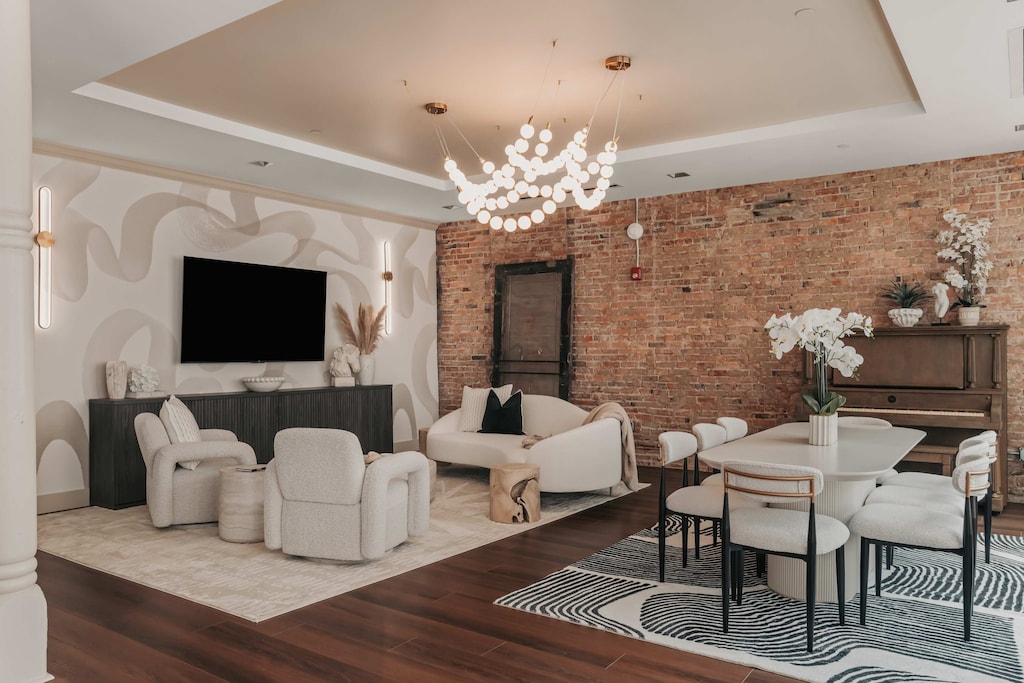 The open-concept living area includes a stylish lounge, a dining room with a piano, and a game room complete with a pool table—perfect for both relaxing and entertaining.