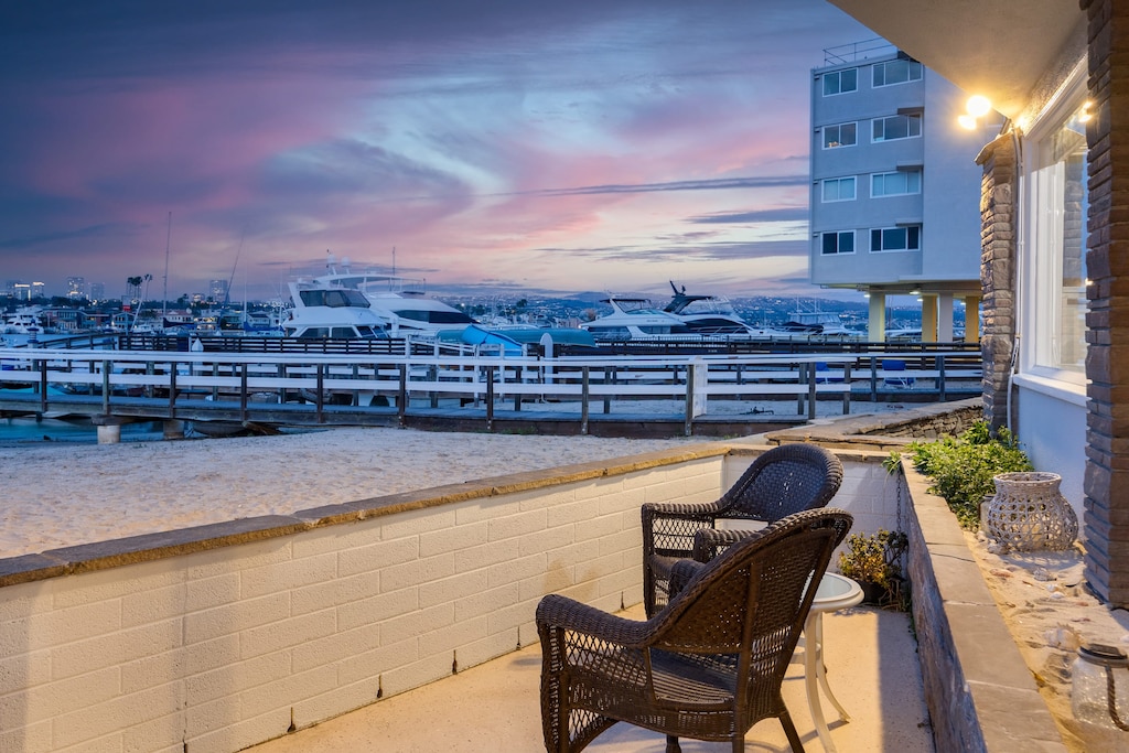 Waterfront balcony with outdoor dining.