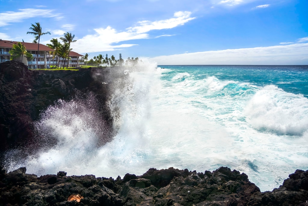 Feel the power of the Pacific as waves crash along the rugged Kona coastline.