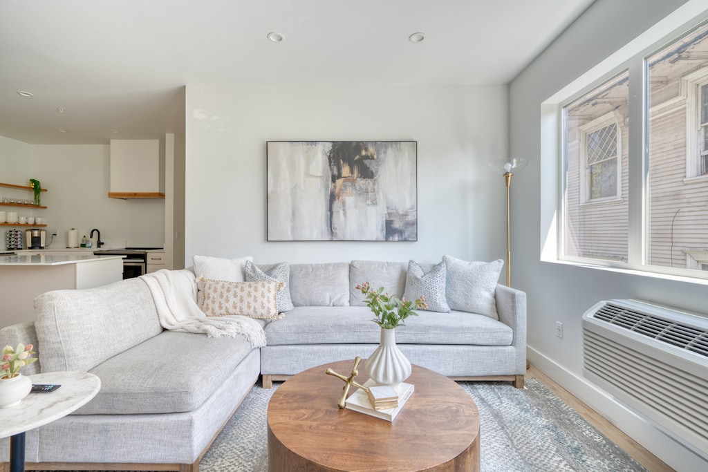 Living room 1 with bright sofa seating.
