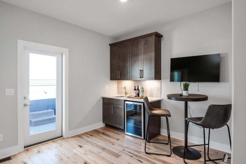 Rooftop patio access from the stylish wet bar upstairs.