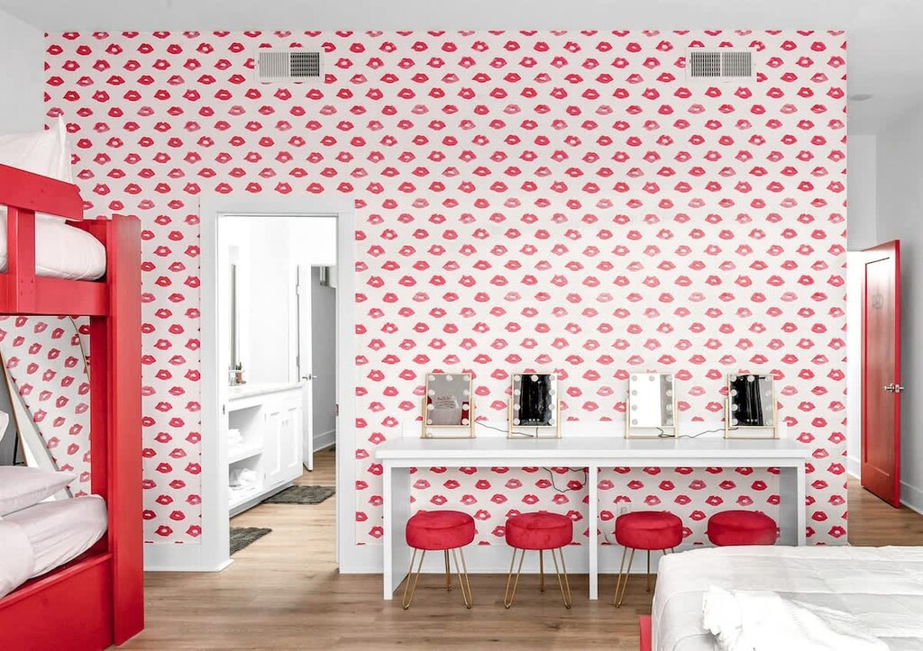 Bedroom 1 - RED. King bed and bunk beds. Make up area.
