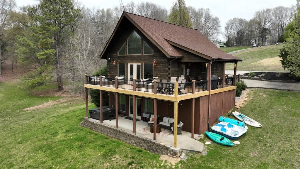 Rustic cabin with wraparound deck and nature views.