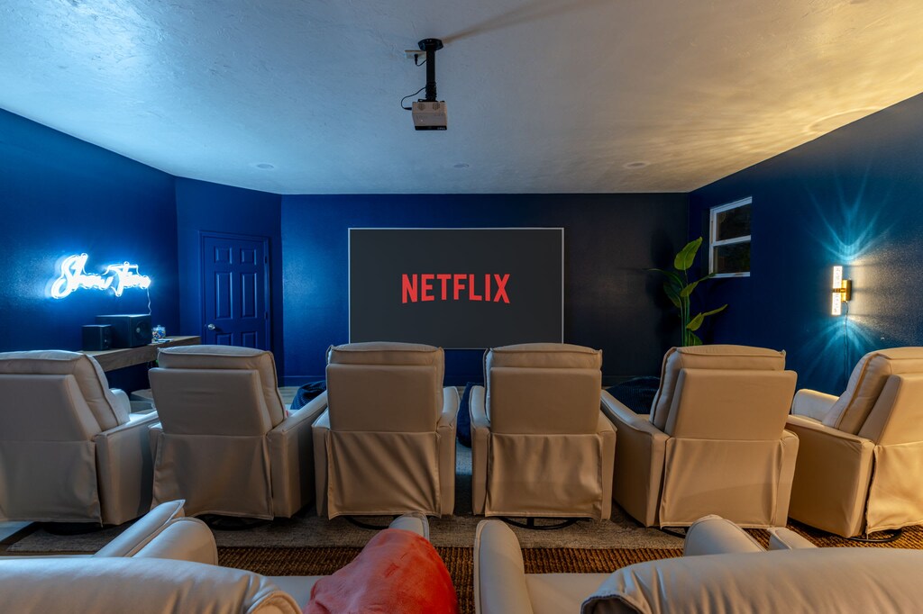 Kick back in the private movie theater featuring reclining chairs and a big-screen projector—your own personal cinema experience!