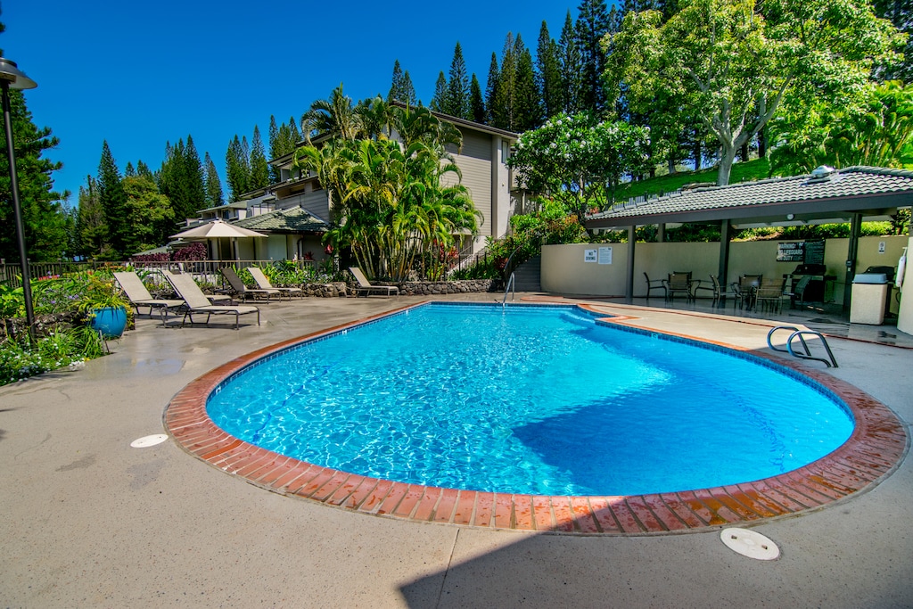 One of four sparkling pools available to guests—ideal for a refreshing dip after a day at the beach or golf course. Each with BBQ grills for guest use.
