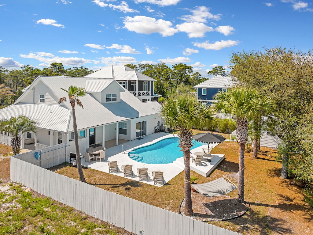 Palm trees add to the charm and character of this home.