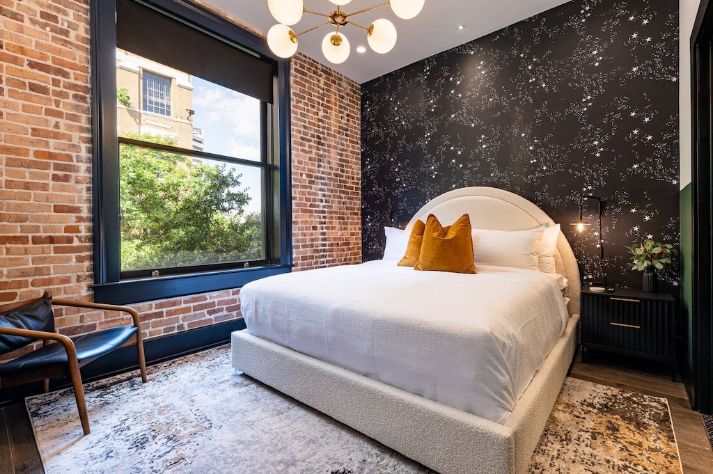 Retreat to the Primary bedroom with a plush king bed, walk-in closet, blackout shades, and a smart TV. Designed for comfort and privacy, this suite is perfect for recharging after a day exploring New Orleans.