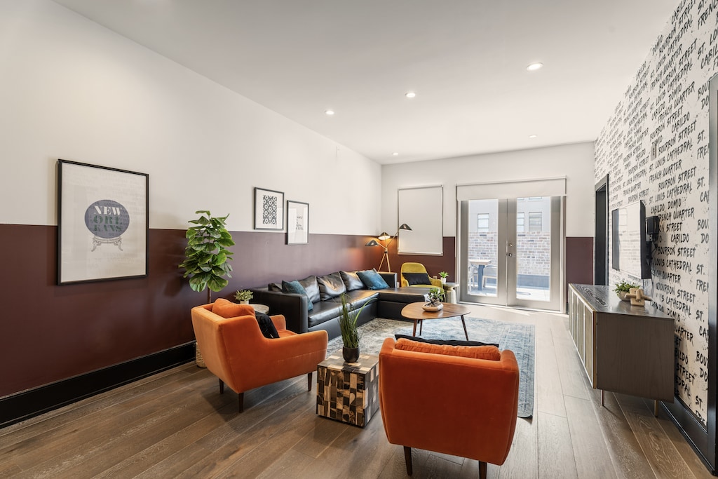 Relax in the living area with a smart TV, stylish seating, and a sleeper sofa for extra guests. Perfect for families or group stays in New Orleans, this inviting space is ideal for movie nights or recharging after a day in the city.