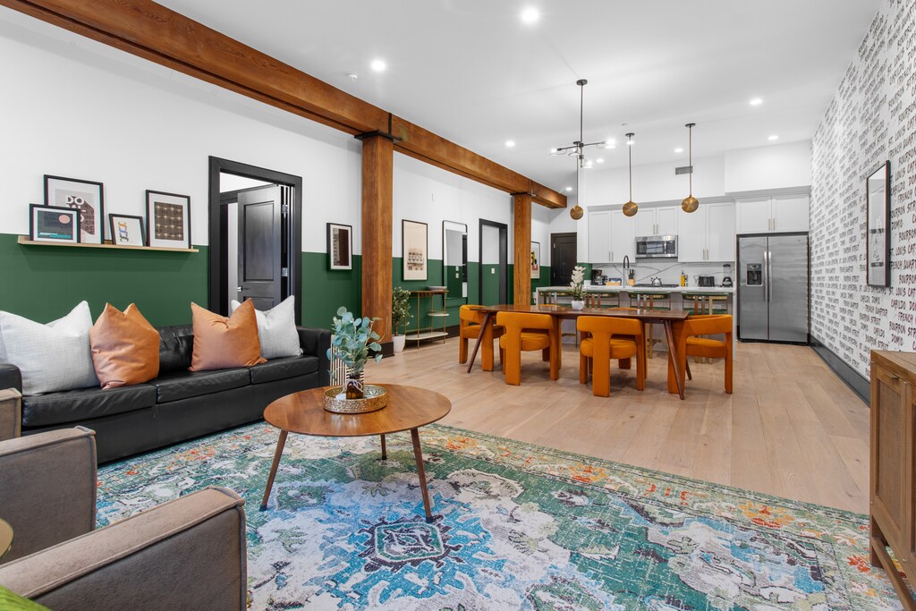 Relax in the living area with a smart TV, stylish seating, and a sleeper sofa for extra guests. Perfect for families or group stays in New Orleans, this inviting space is ideal for movie nights or recharging after a day in the city.